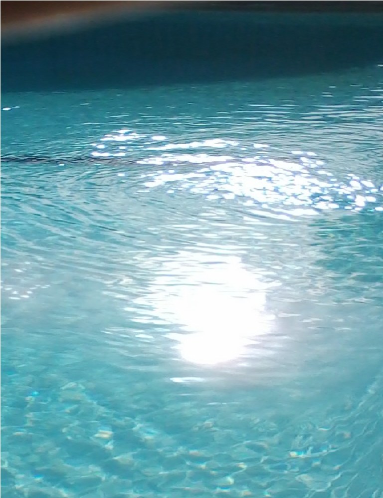 Sunlight reflected on a pool of water